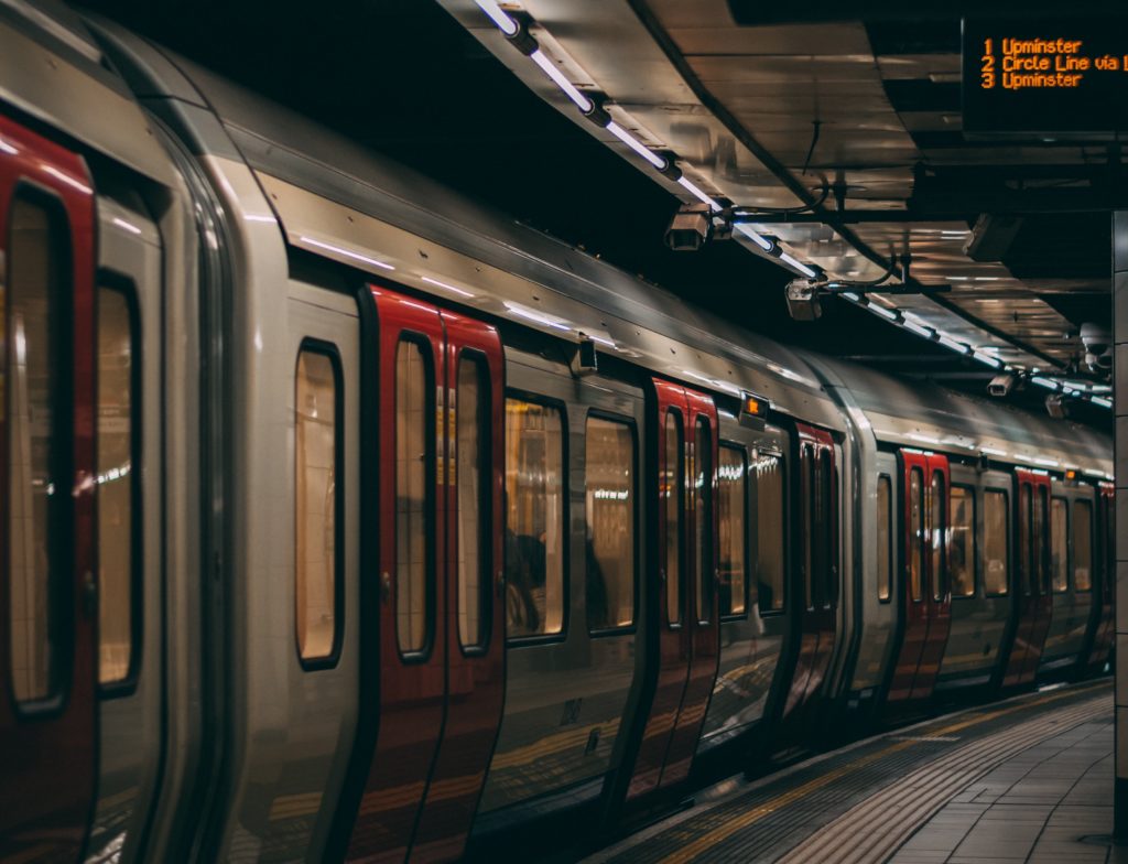 5G innovations can make for a better mass transit system A subway train arrives. Multiple security cameras dot the ceiling.